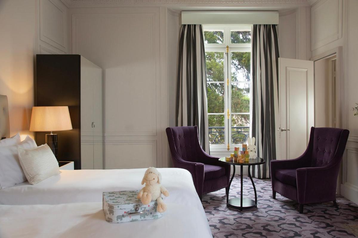 Un ou plusieurs lits dans un hébergement de l'établissement Waldorf Astoria Versailles - Trianon Palace