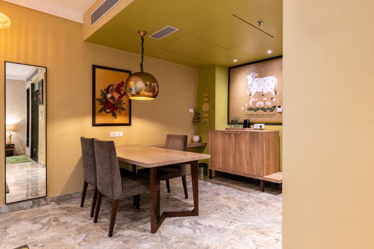 a dining room with a table and chairs at Antalya By Divine Ganga Cottage in Rishīkesh