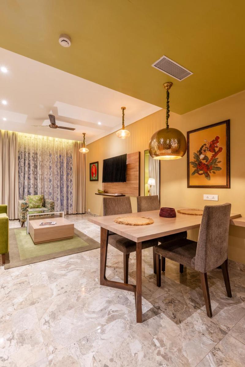 a dining room with a table and chairs at Antalya By Divine Ganga Cottage in Rishīkesh