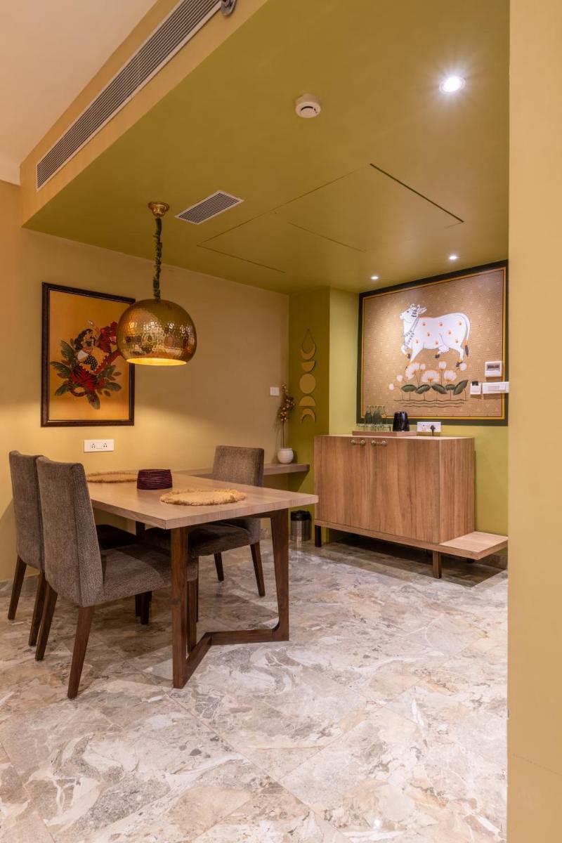 a dining room with a table and chairs at Antalya By Divine Ganga Cottage in Rishīkesh