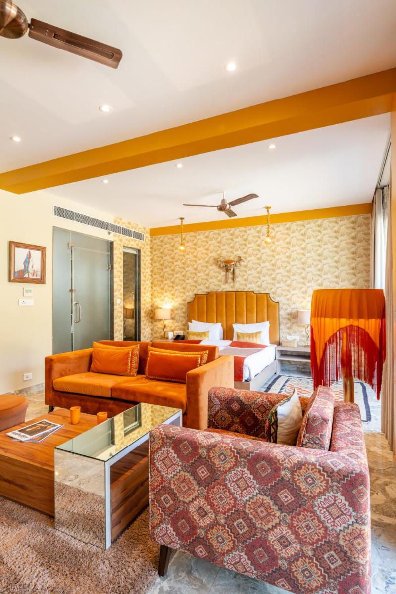 a living room with two couches and a table at Antalya By Divine Ganga Cottage in Rishīkesh