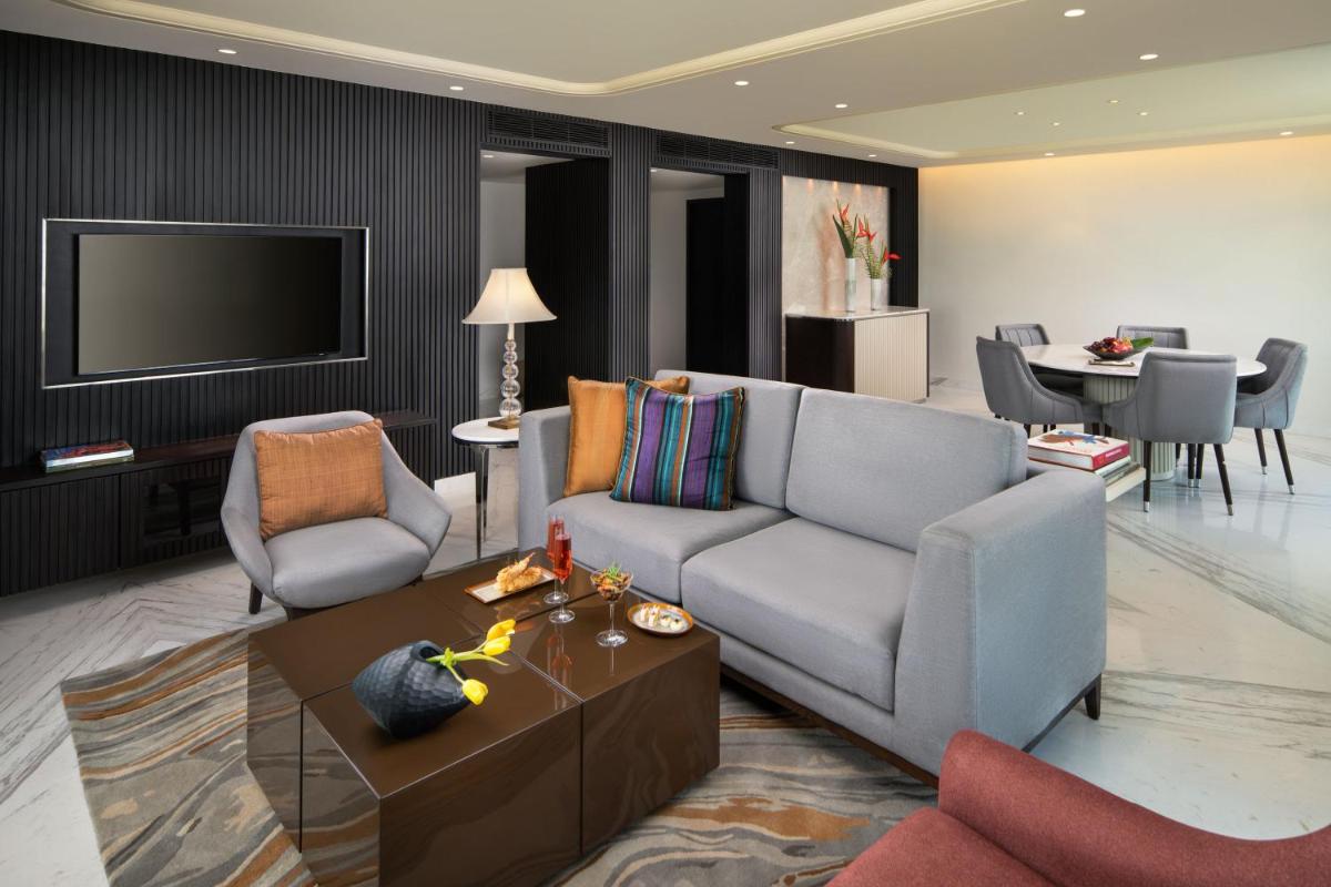 a living room with a couch and a table at Taj Krishna in Hyderabad