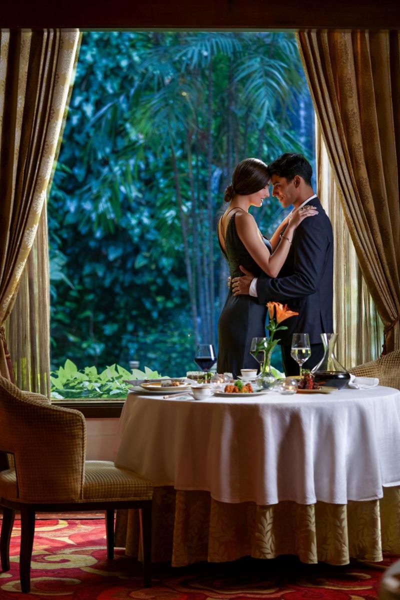 a man and a woman standing at a table at Taj Krishna in Hyderabad
