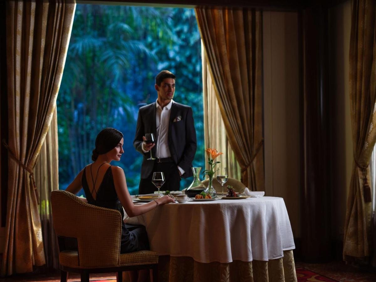 a man and a woman sitting at a table at Taj Krishna in Hyderabad