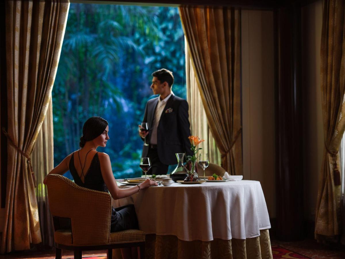 a man and a woman sitting at a table at Taj Krishna in Hyderabad