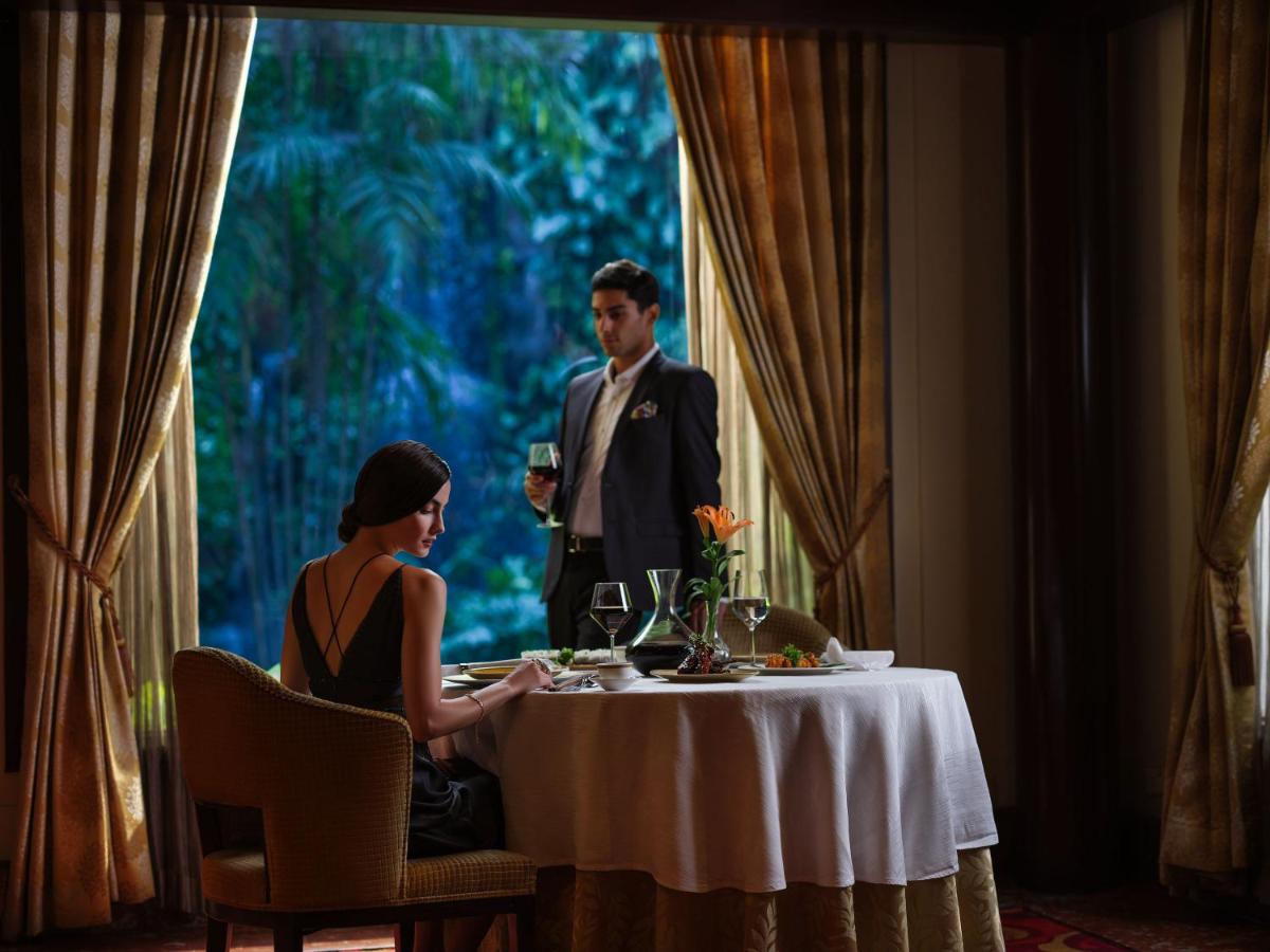 a man and a woman sitting at a table at Taj Krishna in Hyderabad