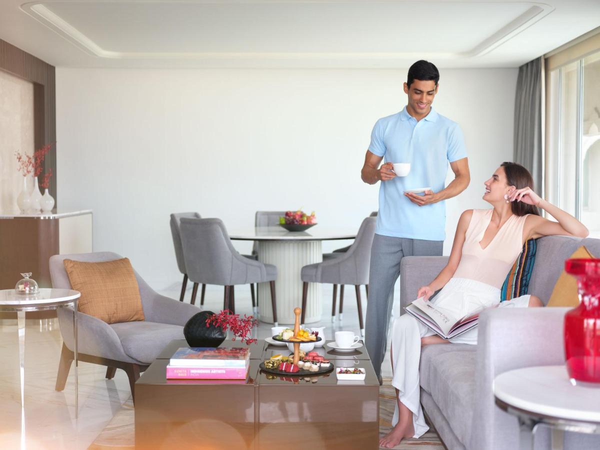 a man and a woman sitting in a living room at Taj Krishna in Hyderabad