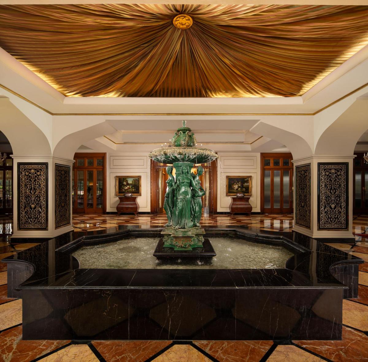 a large lobby with a fountain in the middle at Taj Krishna in Hyderabad