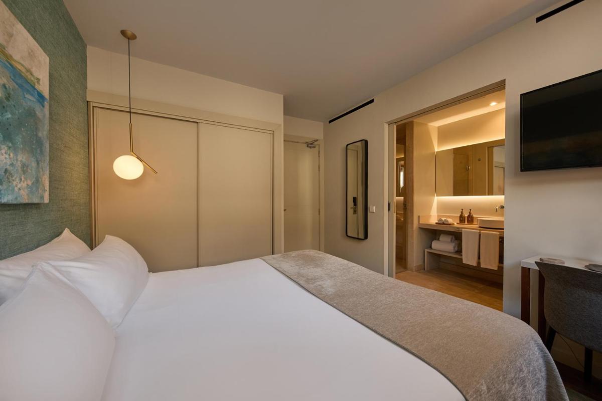 Cama o camas de una habitación en Sant Jaume Design Hotel