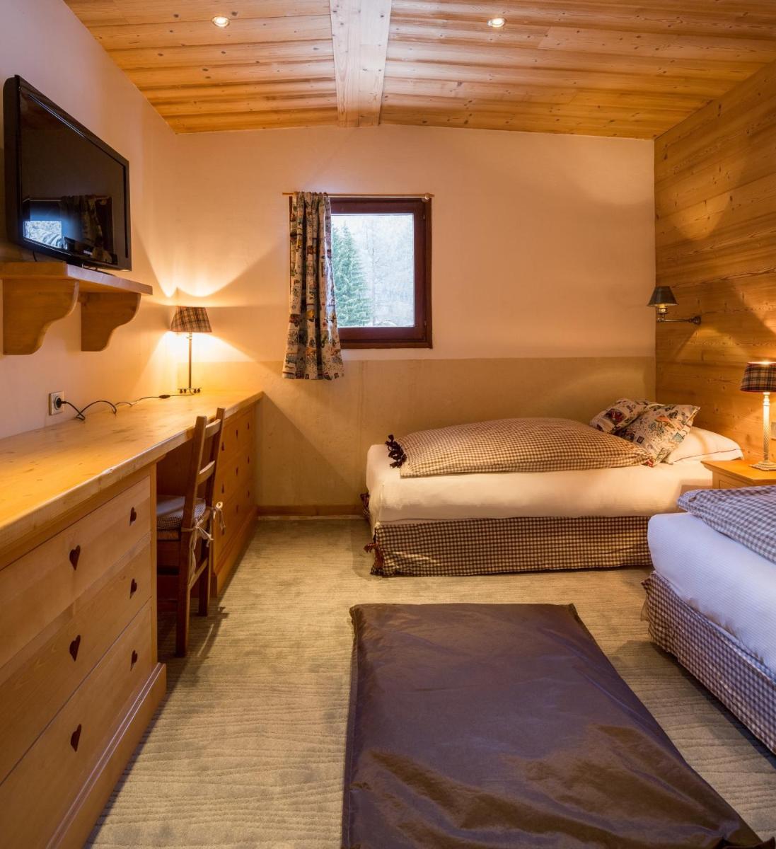 Un ou plusieurs lits dans un hébergement de l'établissement Les Grands Montets Hotel & Spa
