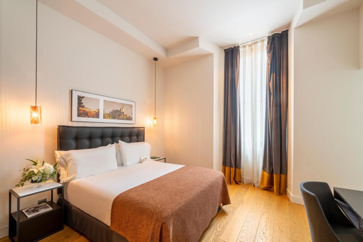 Cama o camas de una habitación en Áurea Convento Capuchinos by Eurostars Hotel Company
