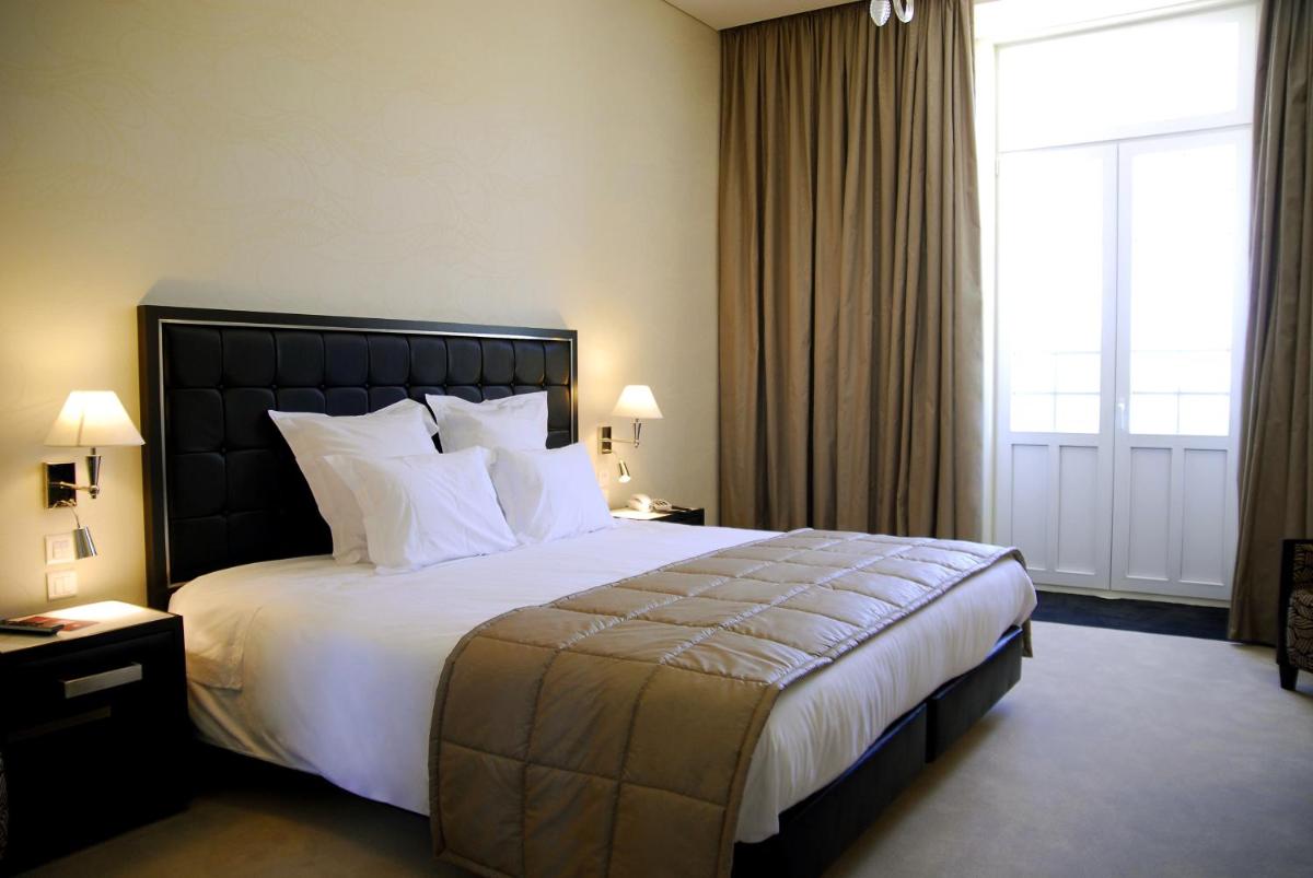 Uma cama ou camas num quarto em Curia Palace Hotel & Spa