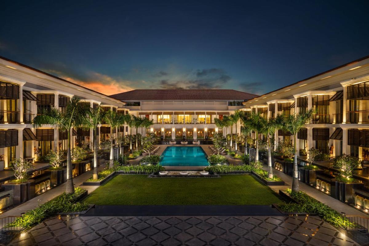 an exterior view of a resort with a swimming pool at Taj Taal Kutir in Kolkata an exterior view of a resort with a swimming pool at Taj Taal Kutir in Kolkata