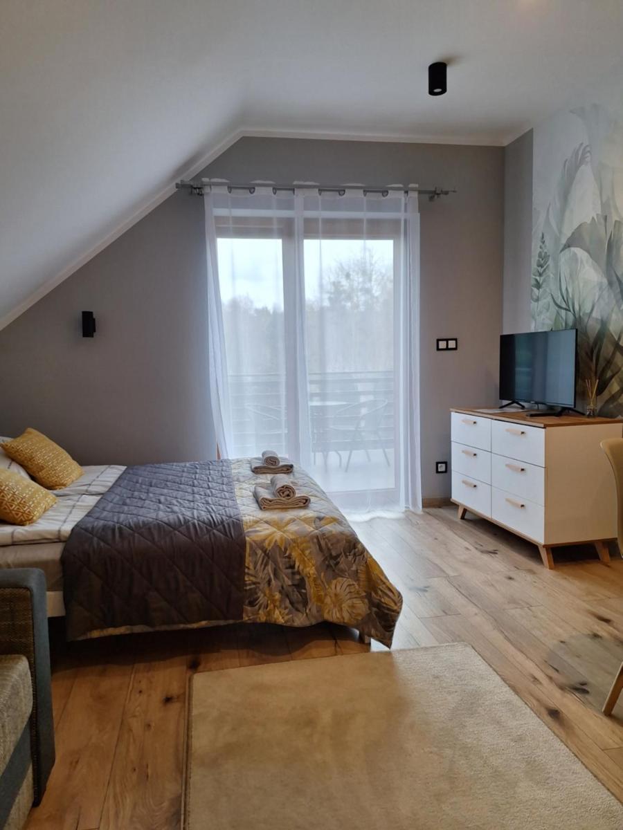 Apartamenty Dębowy Zakątek w Dolinie Baryczy - Housity