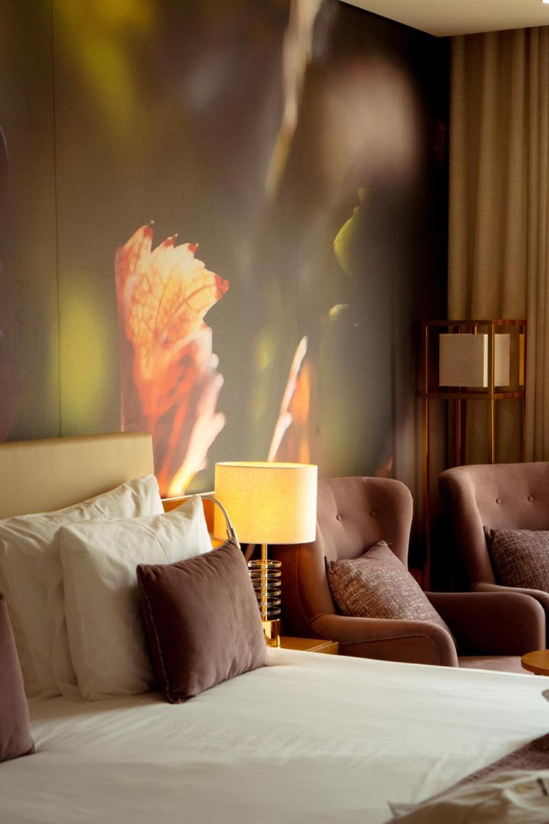 Uma cama ou camas num quarto em Douro Castelo Signature Hotel & Spa