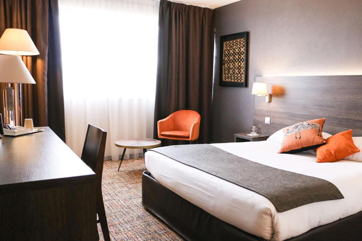 Un ou plusieurs lits dans un hébergement de l'établissement Best Western Plus Hotel Admiral