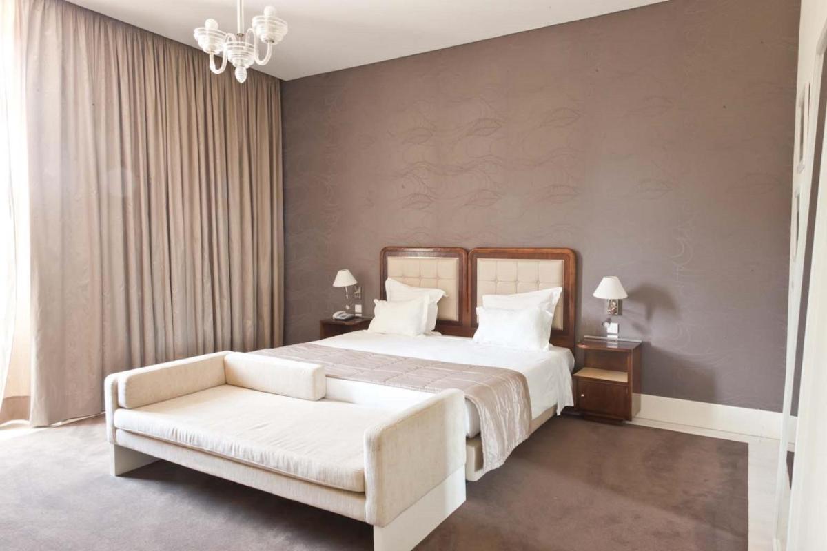 Uma cama ou camas num quarto em Curia Palace Hotel & Spa