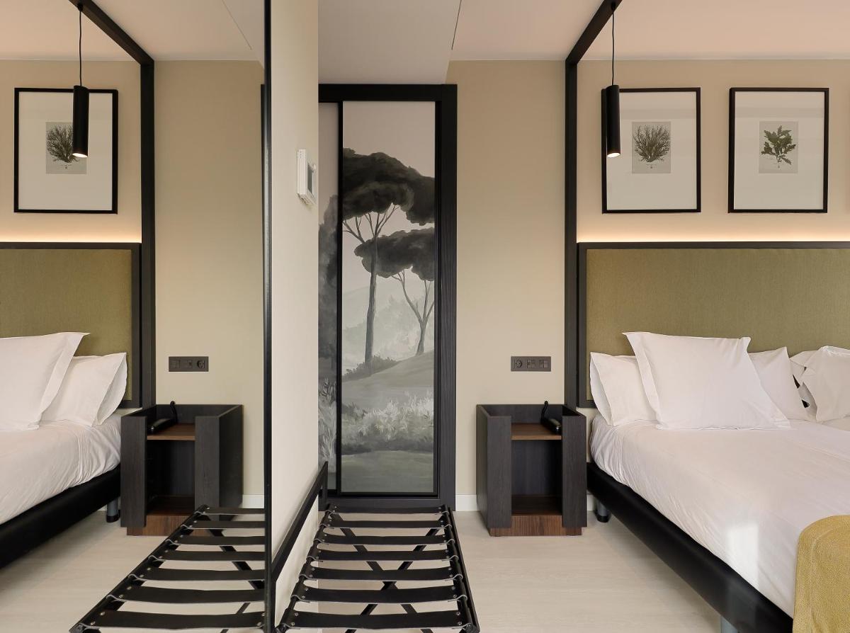 Cama o camas de una habitación en Nuvō Hotel Boutique