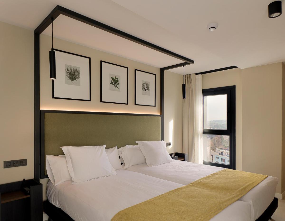 Cama o camas de una habitación en Nuvō Hotel Boutique