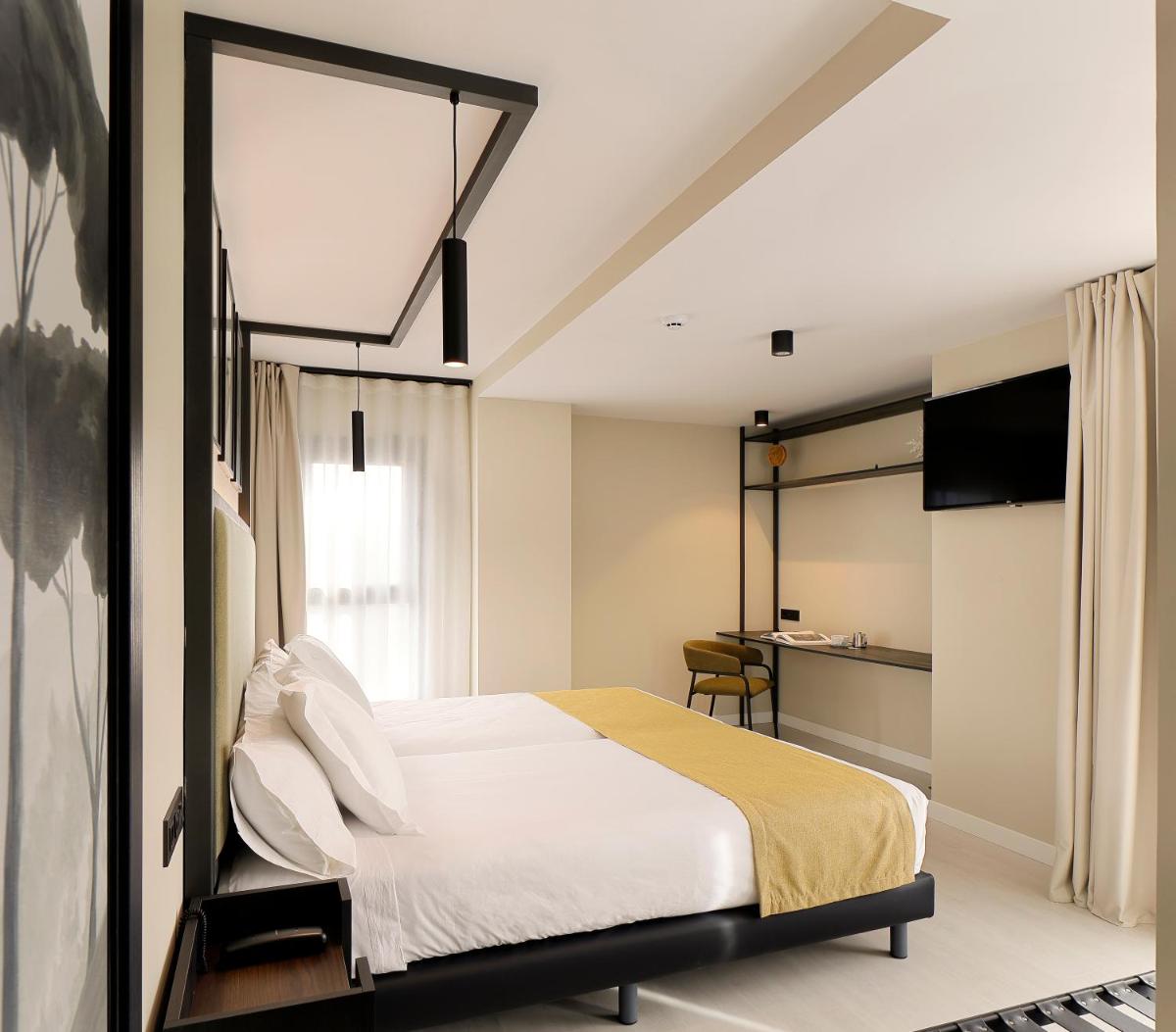 Cama o camas de una habitación en Nuvō Hotel Boutique