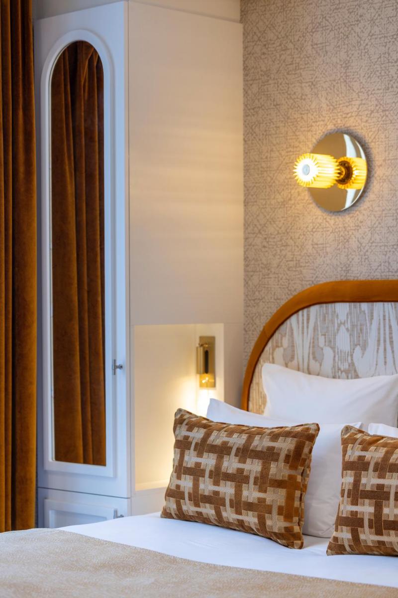 Un ou plusieurs lits dans un hébergement de l'établissement Hotel des Carmes by Malone