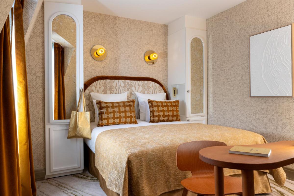 Un ou plusieurs lits dans un hébergement de l'établissement Hotel des Carmes by Malone