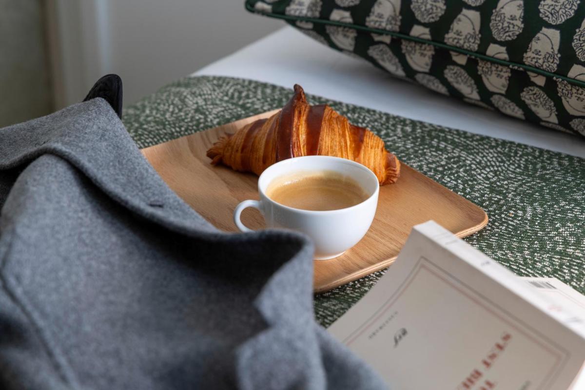 Un ou plusieurs lits dans un hébergement de l'établissement Hotel des Carmes by Malone