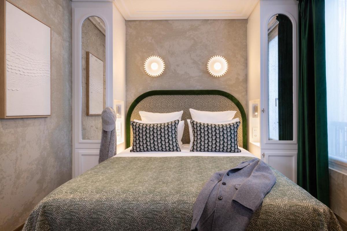 Un ou plusieurs lits dans un hébergement de l'établissement Hotel des Carmes by Malone