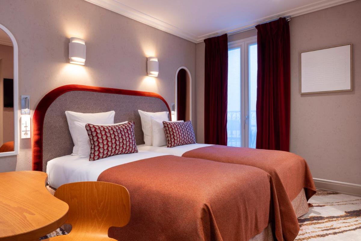 Un ou plusieurs lits dans un hébergement de l'établissement Hotel des Carmes by Malone
