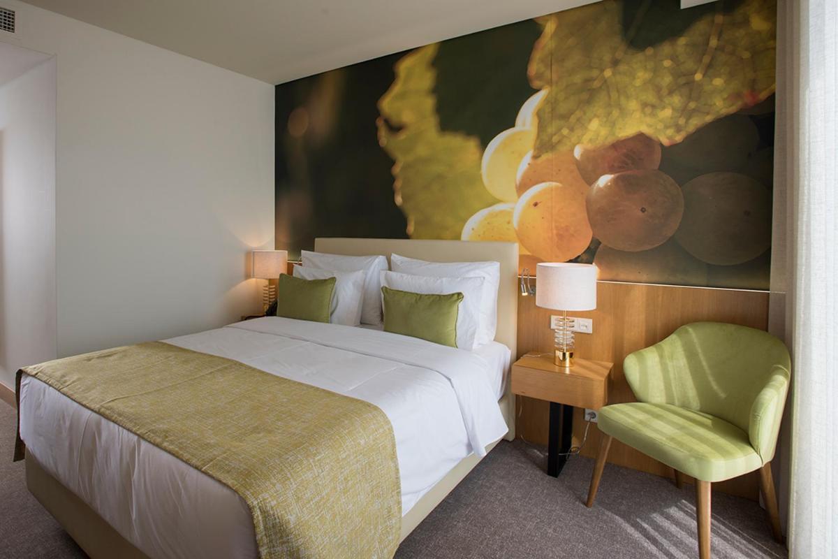 Uma cama ou camas num quarto em Douro Castelo Signature Hotel & Spa