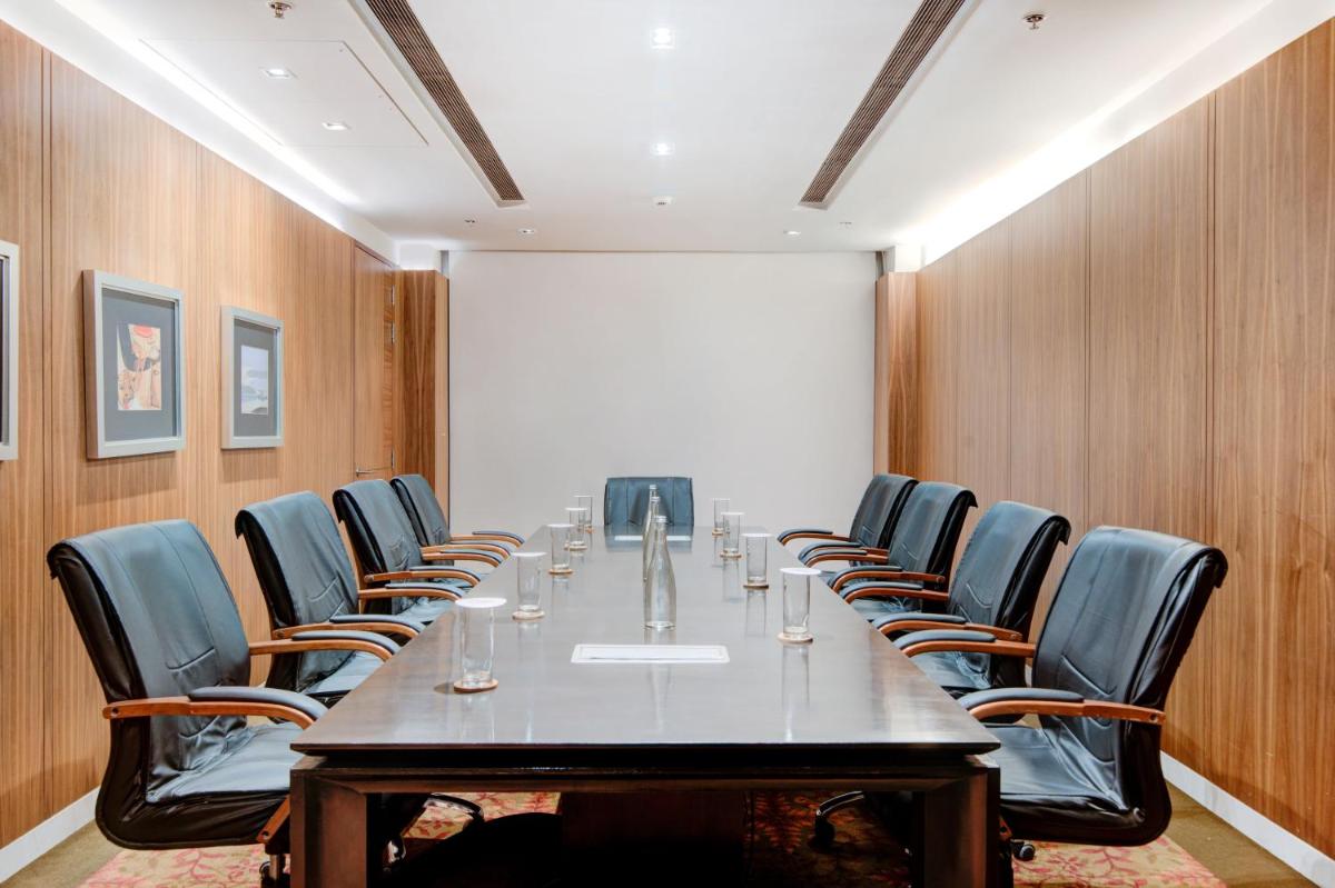 a conference room with a long table and chairs at Hyatt Ahmedabad in Ahmedabad