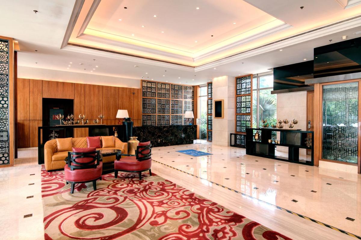 a living room with a couch and a table at Hyatt Ahmedabad in Ahmedabad