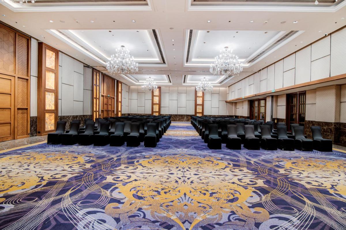 an empty conference room with chairs and a carpet at Hyatt Ahmedabad in Ahmedabad +66 photos