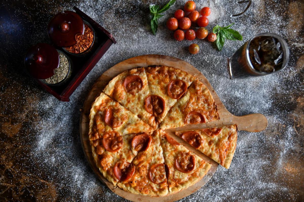 a pizza sitting on top of a table at Hyatt Ahmedabad in Ahmedabad
