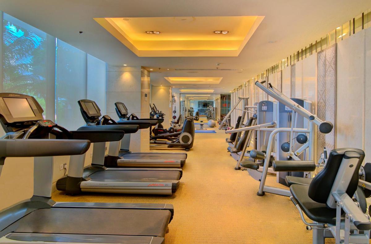 a gym with rows of treadmills and machines at Hyatt Ahmedabad in Ahmedabad