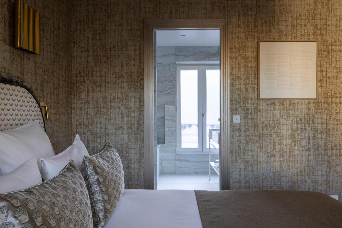 Un ou plusieurs lits dans un hébergement de l'établissement Hotel des Carmes by Malone