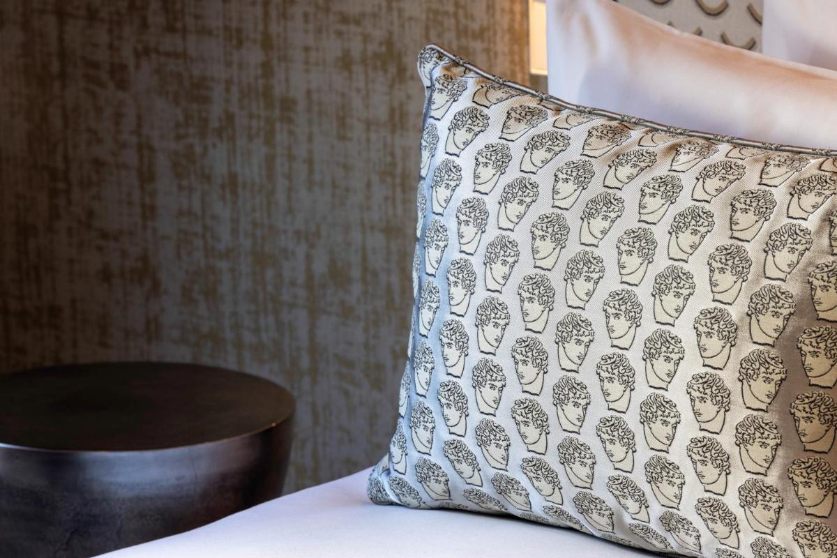 Un ou plusieurs lits dans un hébergement de l'établissement Hotel des Carmes by Malone