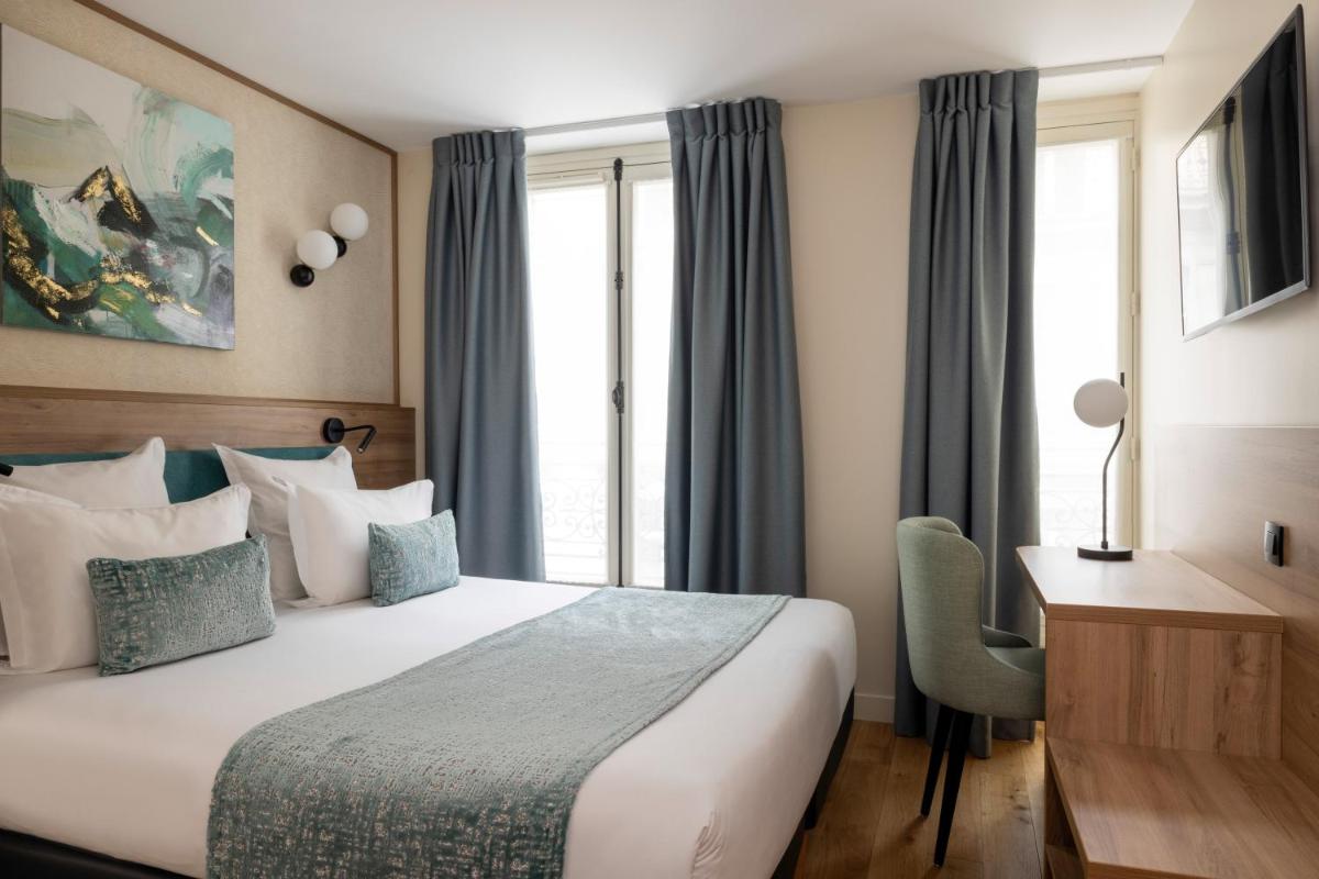 Un ou plusieurs lits dans un hébergement de l'établissement Hôtel Théorème
