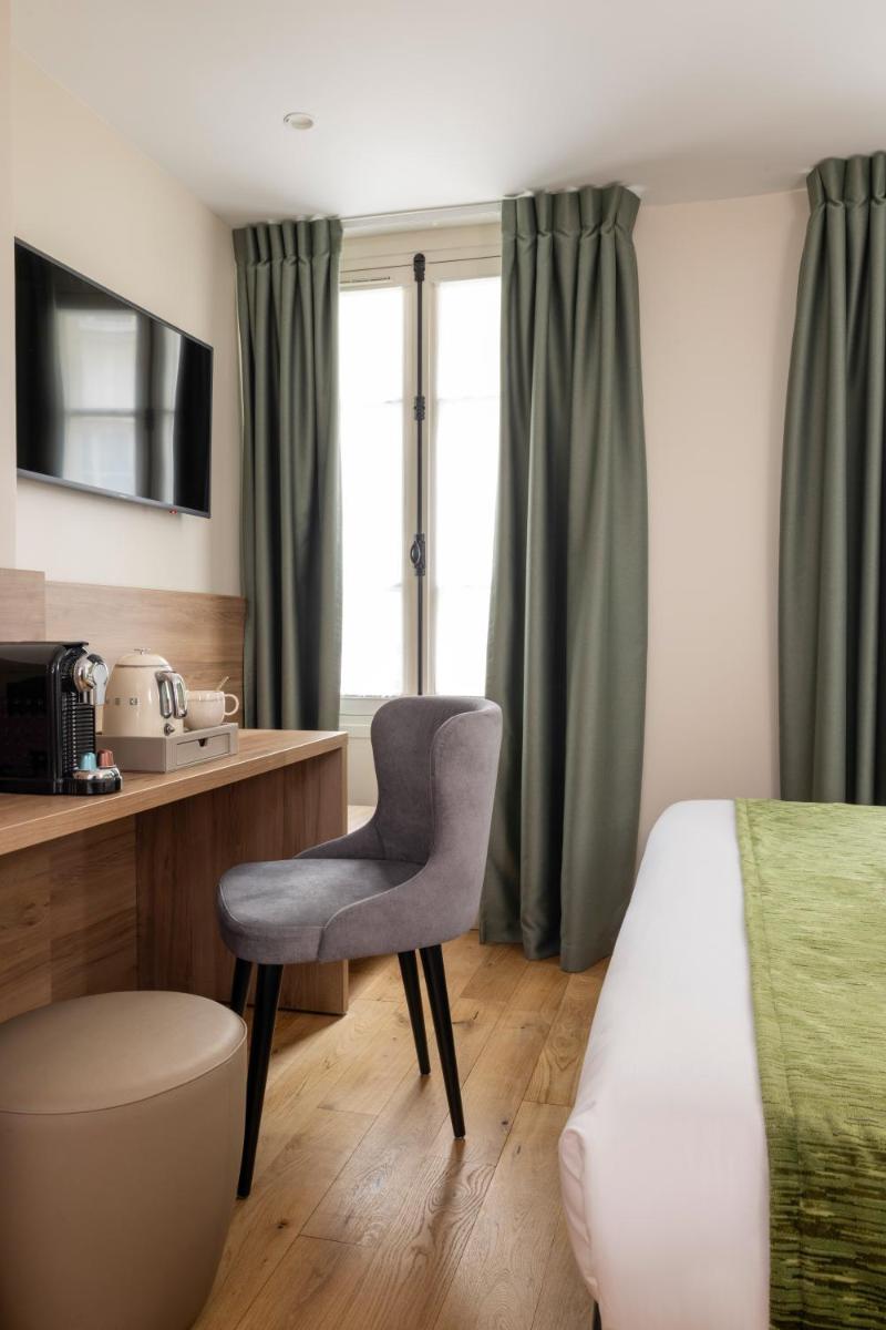 Un ou plusieurs lits dans un hébergement de l'établissement Hôtel Théorème