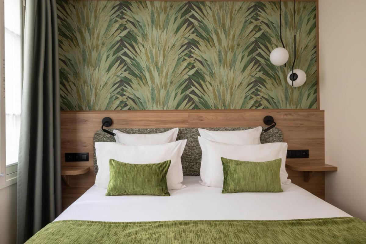 Un ou plusieurs lits dans un hébergement de l'établissement Hôtel Théorème
