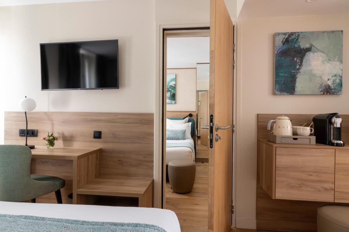 Un ou plusieurs lits dans un hébergement de l'établissement Hôtel Théorème