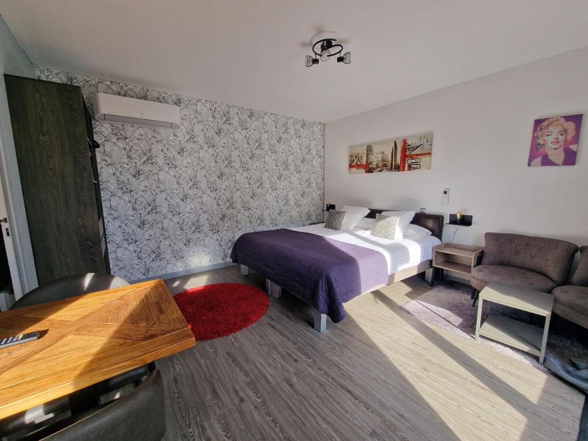 Un ou plusieurs lits dans un hébergement de l'établissement Les Terrasses de Saumur - Hôtel & Appartements - Restaurant & Spa (Logis)