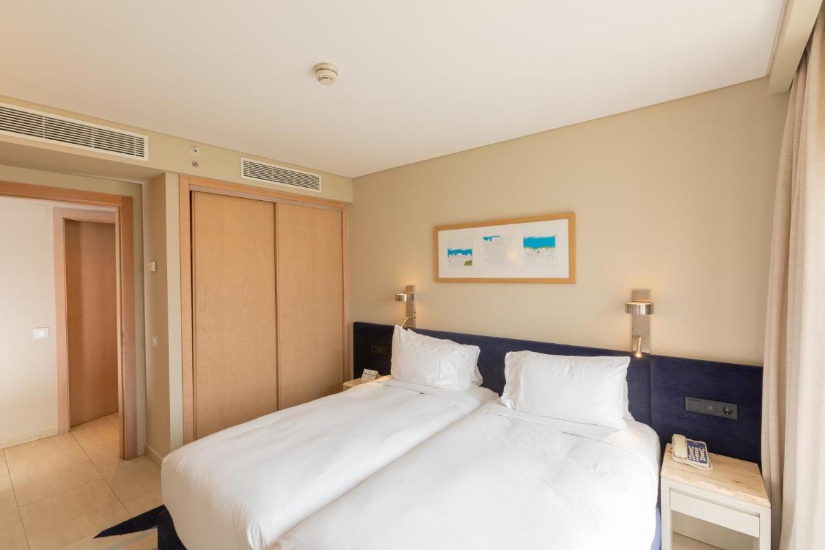 Uma cama ou camas num quarto em Hilton Vilamoura