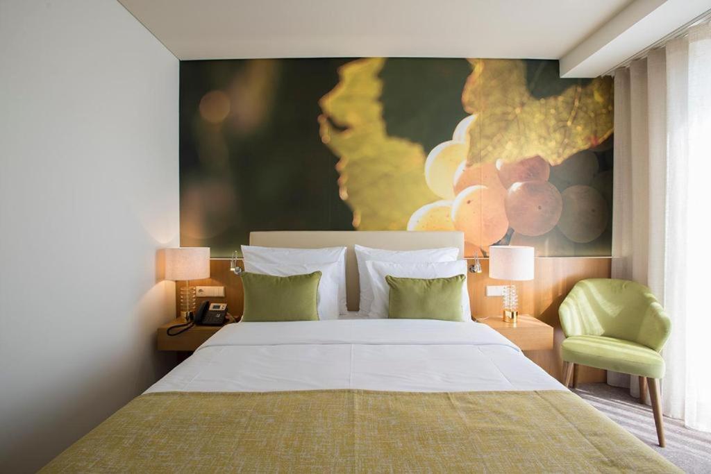 Uma cama ou camas num quarto em Douro Castelo Signature Hotel & Spa