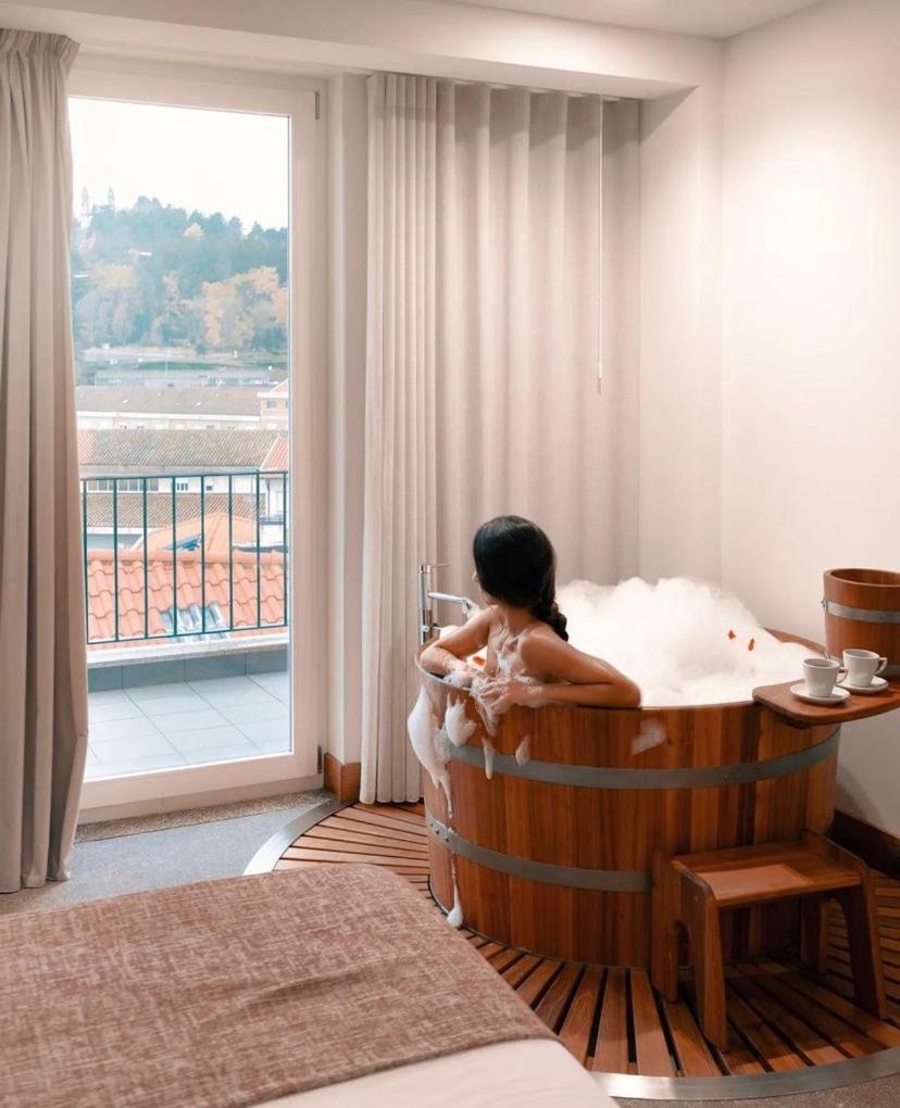 Uma cama ou camas num quarto em Douro Castelo Signature Hotel & Spa