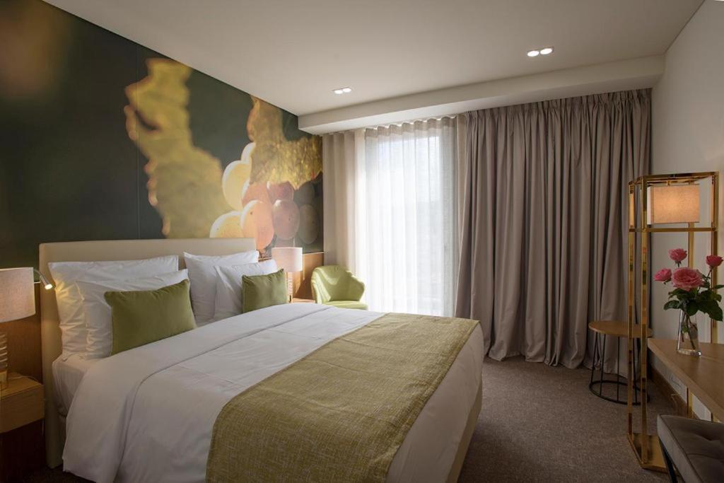 Uma cama ou camas num quarto em Douro Castelo Signature Hotel & Spa
