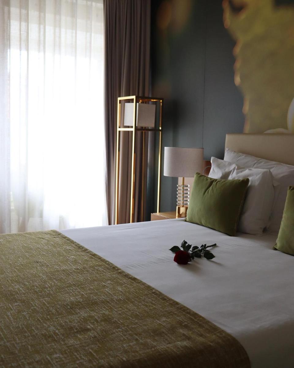 Uma cama ou camas num quarto em Douro Castelo Signature Hotel & Spa