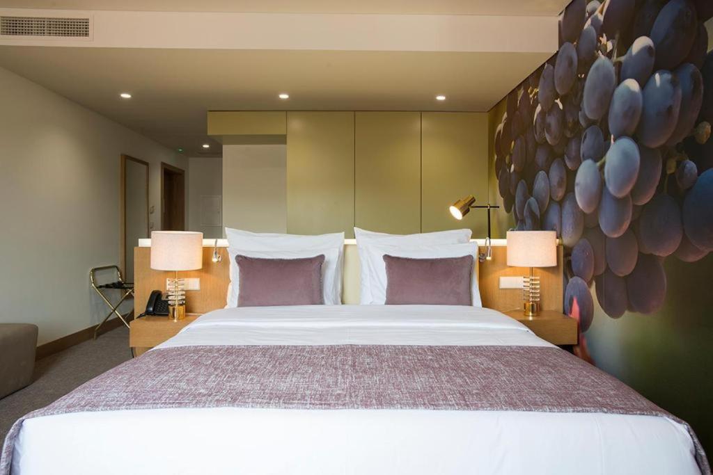 Uma cama ou camas num quarto em Douro Castelo Signature Hotel & Spa