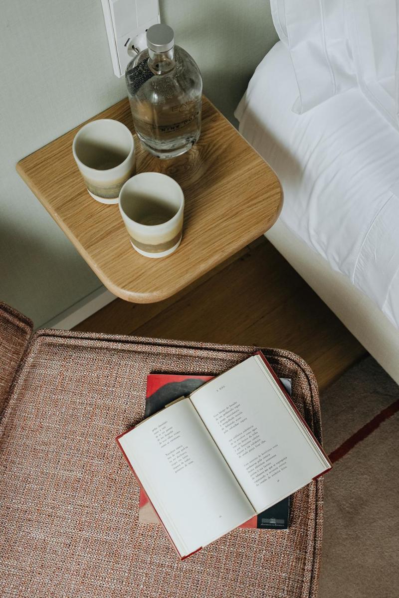 Uma cama ou camas num quarto em NINE DOTS Azorean Art Boutique Hotel