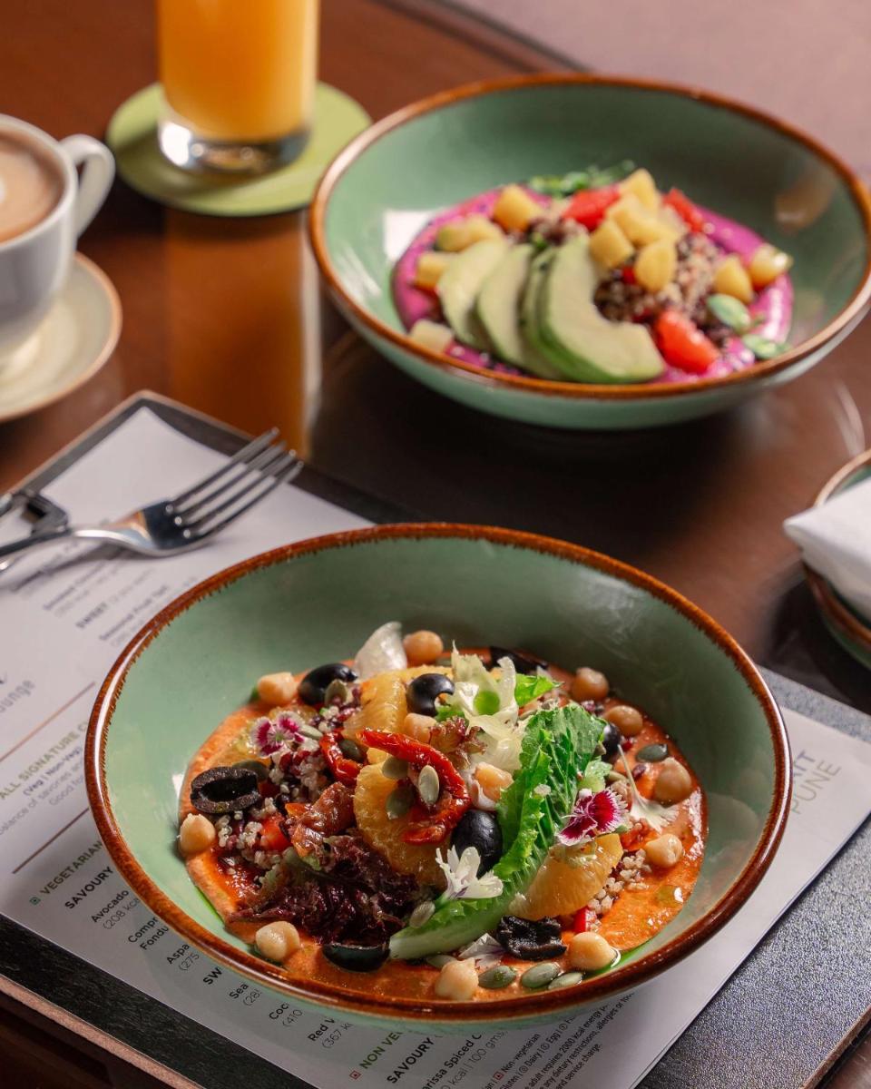 a table with two bowls of food on a table at Hyatt Pune in Pune